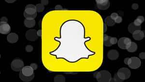 Snapchat應用程式標誌，帶有鬼魂圖標，背景為黑色散景
