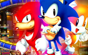 Sonic、Knuckles 和 Tails 在一個霓虹燈照亮、有賽道的未來城市中。 — 超音鼠 壁紙
