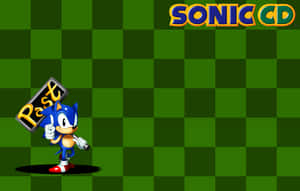 Sonic the Hedgehog 喺綠色格仔背景前舉起一個寫住「Past」嘅牌。 — MacBook Air M4 壁紙