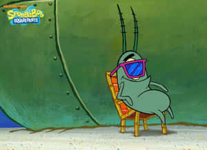 Squidward 戴著太陽眼鏡在潛艇附近的海灘上休息。 — 水下 壁紙