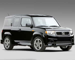 黑色本田Element SUV，配備鉻合金輪轂，灰色攝影棚背景。 — 5:4 壁紙