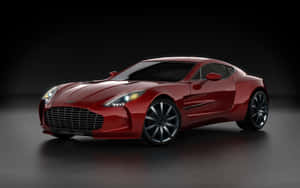 紅色Aston Martin跑車在攝影棚中，帶有戲劇性燈光。 — Steam Deck OLED 壁紙