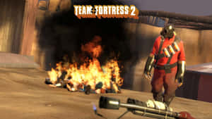 Team Fortress 2 間諜站在沙漠環境中燃燒的屍體堆附近。