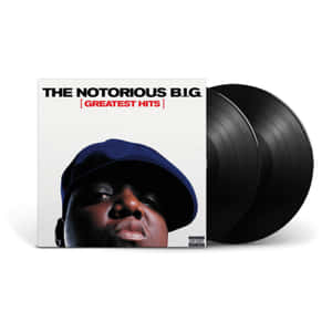 The Notorious B.I.G. Greatest Hits 專輯封面旁邊的黑膠唱片。