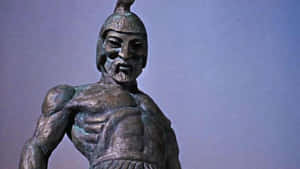 戴頭盔、有鬍鬚的古代戰士青銅雕像，肌肉線條分明。