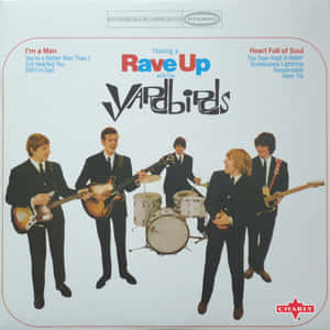The Yardbirds 樂隊穿著西裝在復古專輯封面上演奏樂器。 — 音樂 GIF 壁紙
