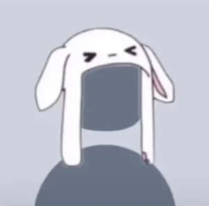 一隻表情不悅的卡通兔，長耳朵，坐在灰色球體上。