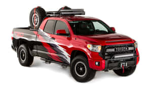帶有自訂圖案和越野裝備的紅色豐田 Tacoma TRD 皮卡車。 — 汽車 壁紙