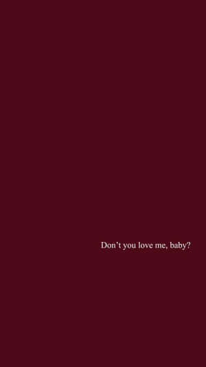 白色文字在棗紅色背景上問「Don't you love me, baby?」