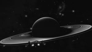 太空船在土星環附近飛行的黑白太空場景