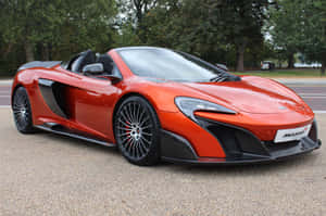 橙色McLaren 650S Spider開篷車停在樹旁的碎石上。 — 秋天 壁紙