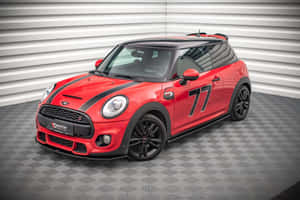 紅色MINI Cooper S賽車，帶有黑色細節和77號碼，在攝影棚環境中。 — Surface Laptop 壁紙