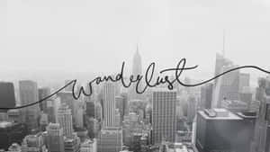 黑白城市景觀，帶有'Wanderlust'文字疊加，啟發旅行靈感。
