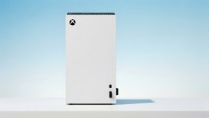 白色Xbox主機置於白色表面，配藍色漸變背景