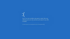 Windows PC錯誤畫面，帶有悲傷表情和重新啟動訊息