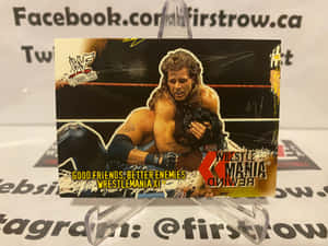 WWE WrestleMania XIX 收藏卡，顯示一名摔角手在擂台上壓制另一名摔角手。