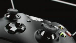黑色Xbox手掣，焦點喺彩色按鈕上。