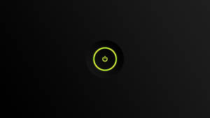 在深色背景上的一個發光綠色電源按鈕。