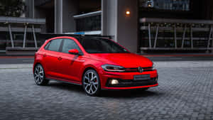 夜晚停泊在城市廣場上的紅色福士Polo GTI。 — Polo g GIF 壁紙