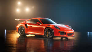 橙色保時捷911 GT2 RS在潮濕地板上，工作室燈光下
