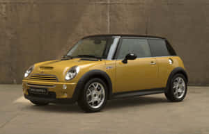 黃色Mini Cooper S汽車在混凝土牆前 — Steam Deck 壁紙