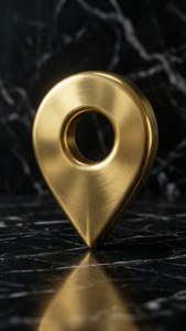 金色位置針在帶有白色紋理和反射的黑色大理石上。