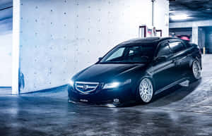 黑色Acura轎車配備定制輪圈，停在混凝土車庫中，藍色燈光下。 — Steam Deck OLED 壁紙