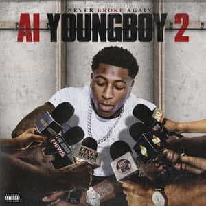 饒舌歌手 YoungBoy Never Broke Again 喺混凝土房入面被新聞咪高峰包圍。