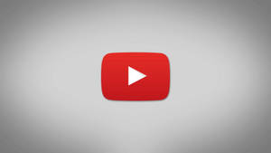 灰色漸變背景上的 YouTube 播放按鈕標誌
