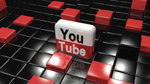 一個3D YouTube標誌方塊被紅色和黑色瓷磚包圍。