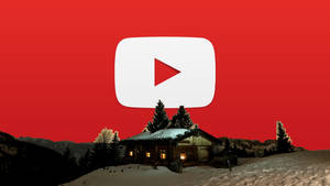 一間積雪的山間小屋，窗戶發光，上方有巨大的YouTube播放按鈕。