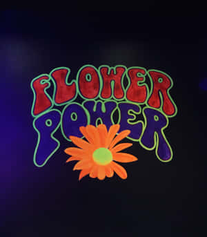 在深色背景上發光的 flower power 文字和橙色雛菊