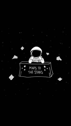 太空人在太空中的桌子旁，桌上寫著「MAPS TO THE STARS」，紙飛機漂浮四周。 — 可愛卡通 壁紙