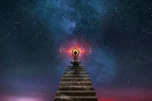 一個人在星空宇宙下的石階上冥想，身後有發光的星雲。 — 靈性動態圖 壁紙
