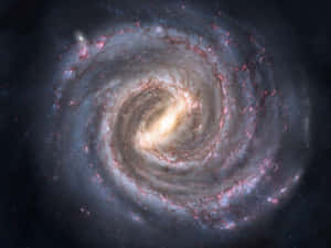 深空中帶有發光粉紅色和藍色星雲的螺旋星系。 — 銀河系 壁紙