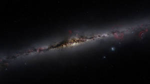 一個在深空中帶有發光紅色星雲和密集星團的螺旋星系。 — 太空 壁紙