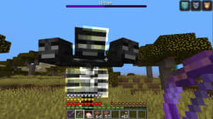 玩家在Minecraft中面對凋零怪首領，生命值和物品欄可見。
