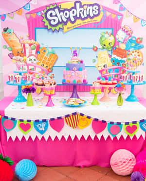 Shopkins生日派對桌，有蛋糕和裝飾。 — Apple Watch 壁紙