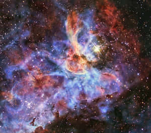 一個色彩繽紛的星雲，充滿了星星和宇宙塵埃，在深空中。 — 星雲 壁紙