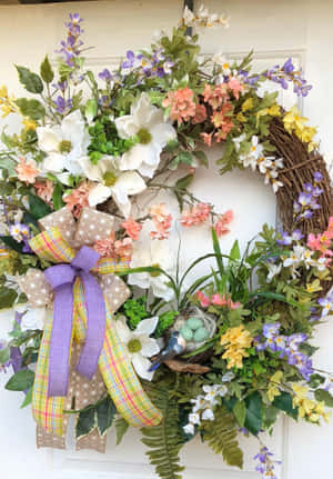 色彩繽紛的春天花環，帶有花朵、蝴蝶結和鳥巢，掛在門上 — IQOO Pad5 壁紙