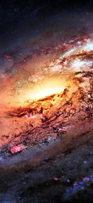 一個色彩繽紛的螺旋星系，在深空中擁有發光的氣體和恆星雲。 — Galaxy Note 壁紙