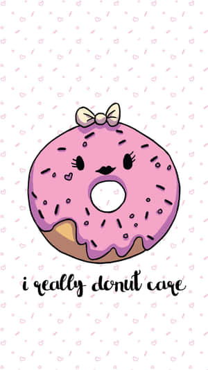 一個微笑的粉紅色糖霜甜甜圈，戴著蝴蝶結，上面寫著 i really donut care。 — 冬甩 壁紙