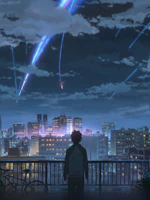 夜晚在城市上空觀看藍色流星的人站在陽台上 — 平板電腦 壁紙