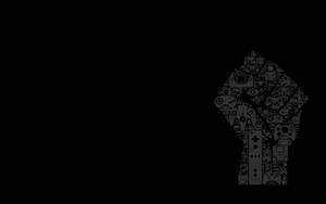一個由電子遊戲控制器組成的舉起拳頭的灰階剪影。 — PlayStation GIF 壁紙