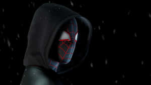 蜘蛛俠身穿黑色連帽衫，面具上有紅色蛛網，在夜間飄雪中。 — Miles Morales 動漫 壁紙