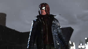 Spider-Man 穿著深色外套，站在雪夜的城市中。 — 超級英雄 壁紙