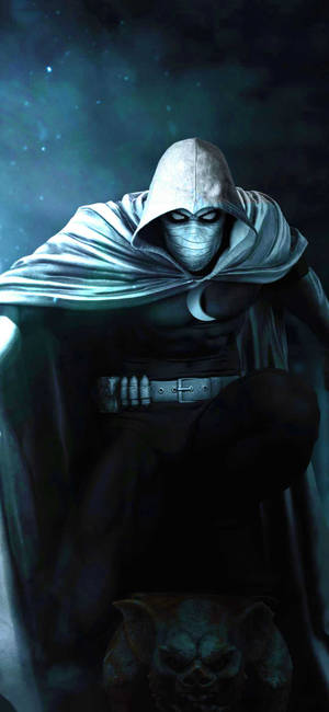 Moon Knight 身穿黑色斗篷和面具，在星空下站立，腳邊有頭骨 — Pixel 9 Pro 壁紙