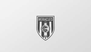Heracles 運動隊標誌，帶有咆哮的獅子和 1903 年成立年份。 — 低飽和度 壁紙