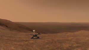 火星表面多塵橙色景觀中的探測車 — 火星 GIF 壁紙