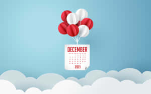 2021年12月日曆在天空中漂浮，帶有紅色和白色氣球，在雲朵之上 — 十二月 GIF 壁紙